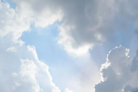 Scattered cloud clusters in a blue sky, blue sky background with white clouds Foto stock