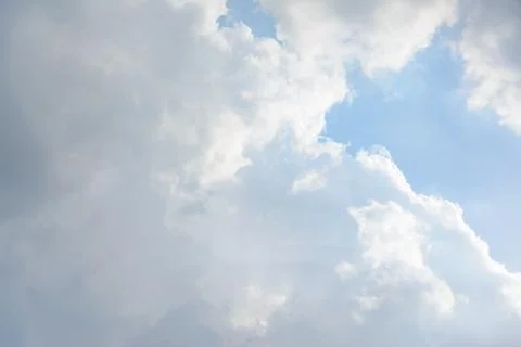 Scattered cloud clusters in a blue sky, blue sky background with white clouds Stock Photos