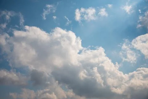 Scattered cloud clusters in a blue sky, blue sky background with white clouds Stock-Fotos