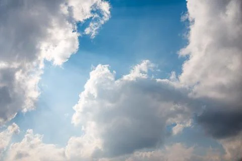 Scattered cloud clusters in a blue sky, blue sky background with white clouds Stock Photos
