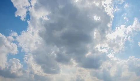 Scattered cloud clusters in a blue sky, blue sky background with white clouds Stock Photos