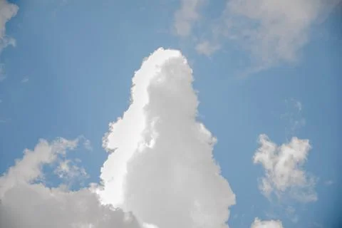 Scattered cloud clusters in a blue sky, blue sky background with white clouds Stock Photos