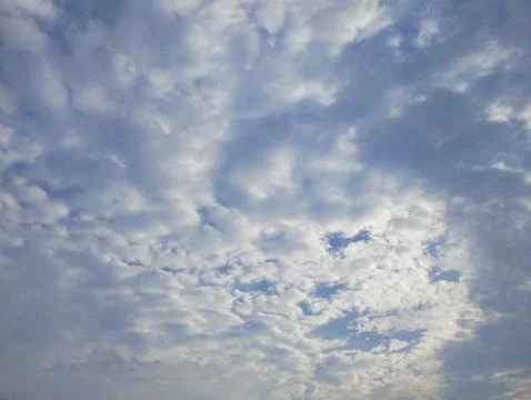 Scattered Clouds in a Blue Sky Stock Photos