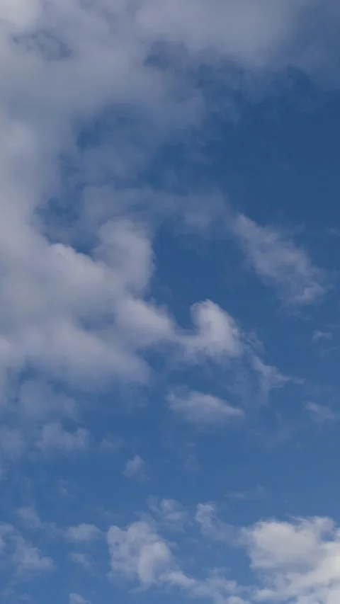 Scattered Clouds Clearing into Deep Blue Sky Time Lapse Vertical Video stock 345938177