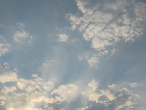 Scattered-clouds-with-sun-rays Stock Photos