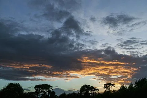 Scattered clouds in sunset sky. Kildare, Ireland Stock Photos