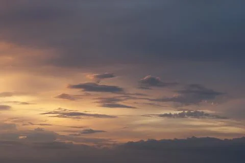 Scattered clouds in sunset sky. Stock Photos