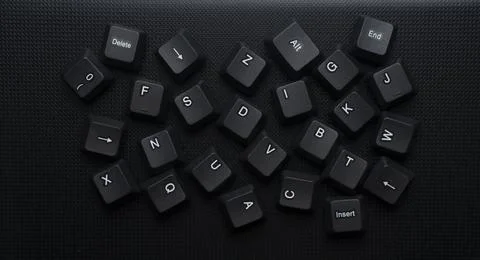 Scattered Computer Keyboard Keys On Dark Background Stock Photos