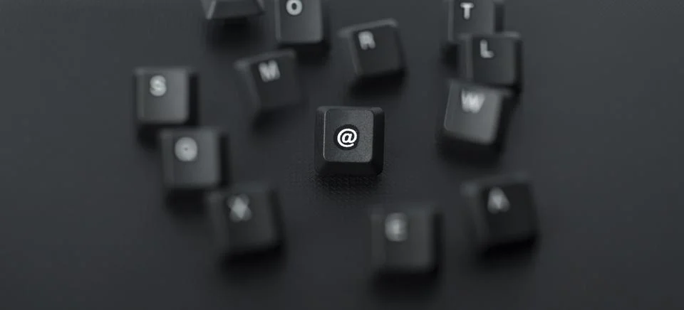 Scattered Computer Keyboard Keys On Dark Background Stock Photos