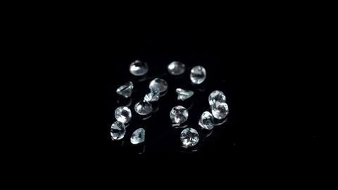 Scattered Diamonds on a Black Surface: A Slow Study of Light and Reflection.. Stock Footage 309414841
