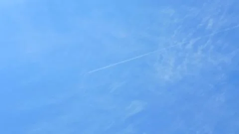 Scattered Fluffy Clouds in a Bright Blue Sky 스톡 사진
