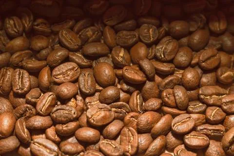 Scattered grains of coffee, suitable background for cafe and coffee shop. Stock Photos