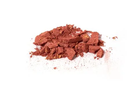 Scattered light brown eye shadow isolated on a white background Foto stock