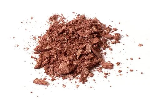 Scattered light brown eye shadow isolated on a white background Stock Photos