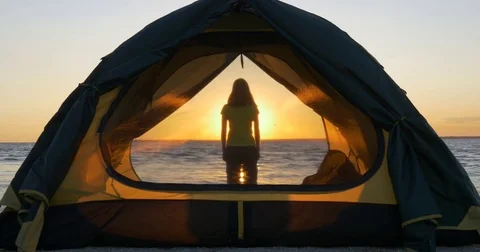 Scattered light through the grid on the tent window and girl Video stock 83575639