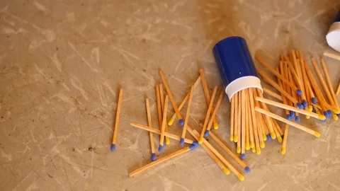 Scattered matches on tan background Stock Footage 88960565