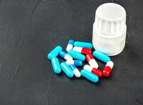 Scattered multicolored capsules Stock Photos