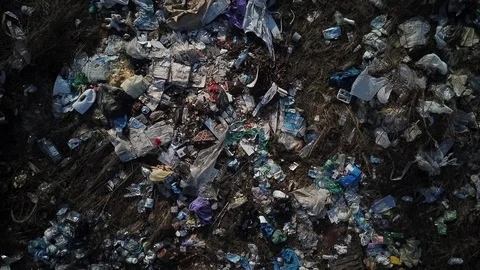 A scattered pile of garbage in the middle of the field Stock Footage 126658790