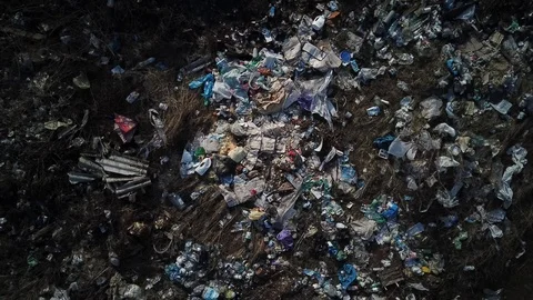 A scattered pile of garbage in the middle of the field Stock Footage 126664344