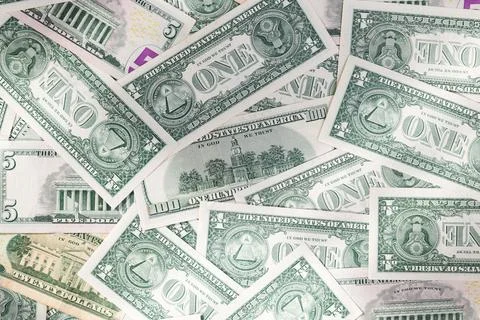 Scattered Pile of Various US Dollar Bills: 1, 5, 20, and 100 Denominations Stock Photos