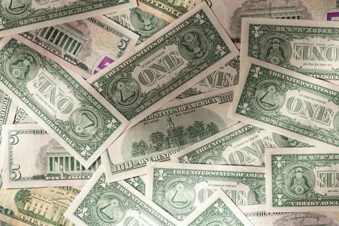 Scattered Pile of Various US Dollar Bills: 1, 5, 20, and 100 Denominations Stock Photos