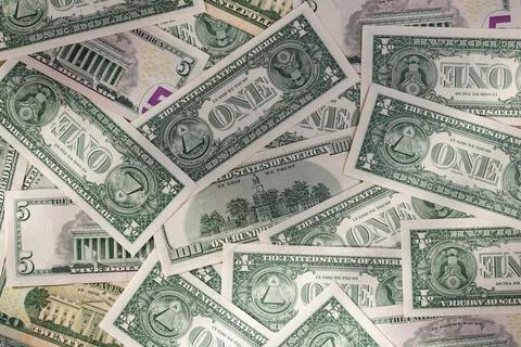Scattered Pile of Various US Dollar Bills: 1, 5, 20, and 100 Denominations Stock Photos