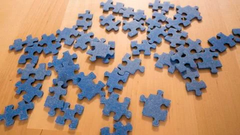 Scattered puzzle on table Stock Photos
