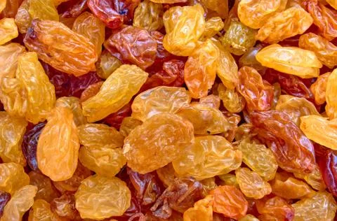 Scattered raisins as a background on the surface Stock Photos