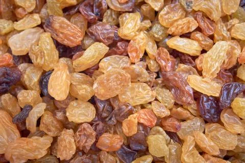 Scattered raisins as a background on the surface Stock Photos