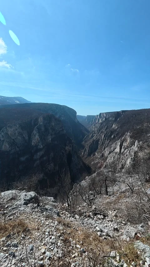 Scattered rocks and dry grass cover the steep slope. Balkan, Eastern Europe, POV Vídeos de archivo 333634682