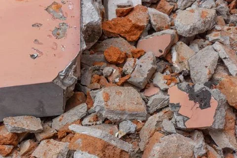 Scattered rubble consisting of broken concrete and reddish-brown bricks Photos