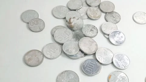 The scattered Rupiah coins with a white background Stock Footage 299737791