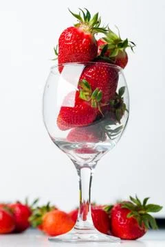 Scattered strawberries on a white background Stock Photos