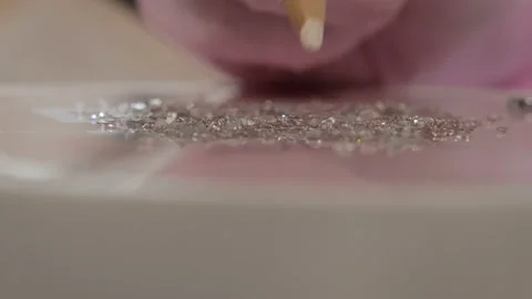 Scattered on the table sequins for manicure Видео 101095556