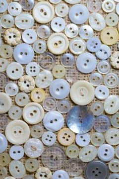Scattered on textile buttons Stock Photos