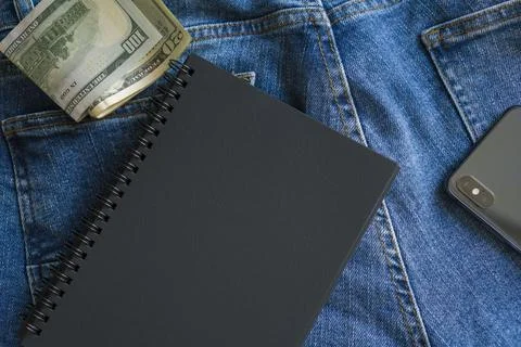 Scattered things on blue jeans. Stock Photos