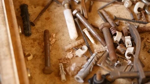 Scattered various screws in the old drawer Stock Footage 88960589