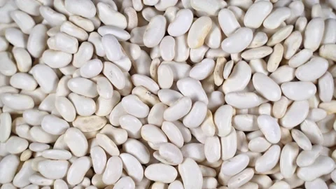 Scattered white beans are rotated on the table. Stock Footage 142466292