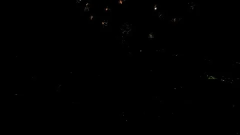 Scattered White Firework Sparks Against Night Sky, 4K Stock Footage 201128771