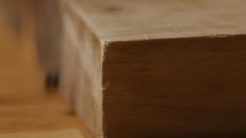 Scattering black pea pepper on kitchen table macro shot Video stock 128493290