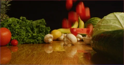 Scattering cherry tomatoes on table with composition of fruits and vegetable Vidéo 126301571