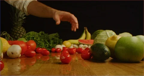 Scattering cherry tomatoes on table with composition of fruits and vegetable Stock Footage 126301614