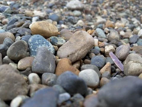 A scattering of colored pebbles of different sizes Stock Photos