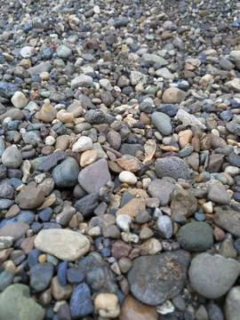 A scattering of colored pebbles of different sizes Stock Photos