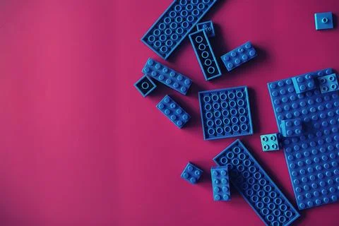 A scattering of constructor elements for children. Colored blue bricks from.. 스톡 사진