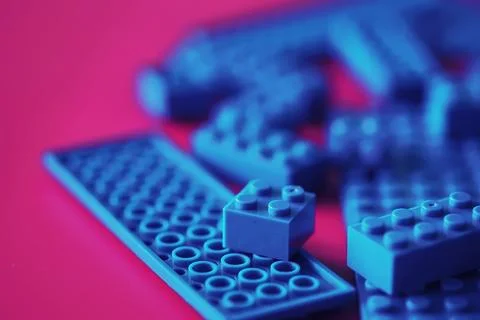 A scattering of constructor elements for children. Colored blue bricks from.. 스톡 사진