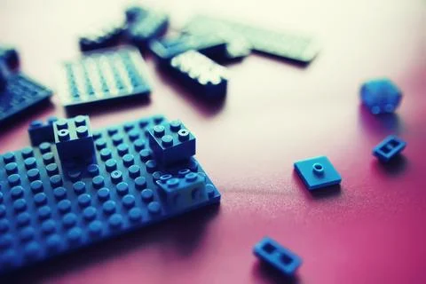 A scattering of constructor elements for children. Colored blue bricks from.. 스톡 사진
