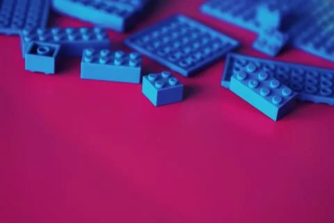 A scattering of constructor elements for children. Colored blue bricks from.. 스톡 사진