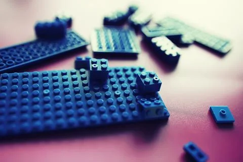 A scattering of constructor elements for children. Colored blue bricks from.. 스톡 사진