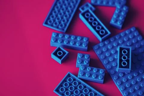 A scattering of constructor elements for children. Colored blue bricks from.. 스톡 사진